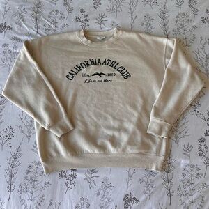 Cream crewneck sweater